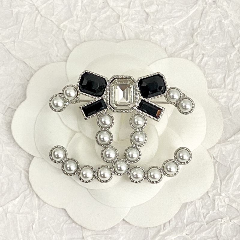 Ch*el brooches